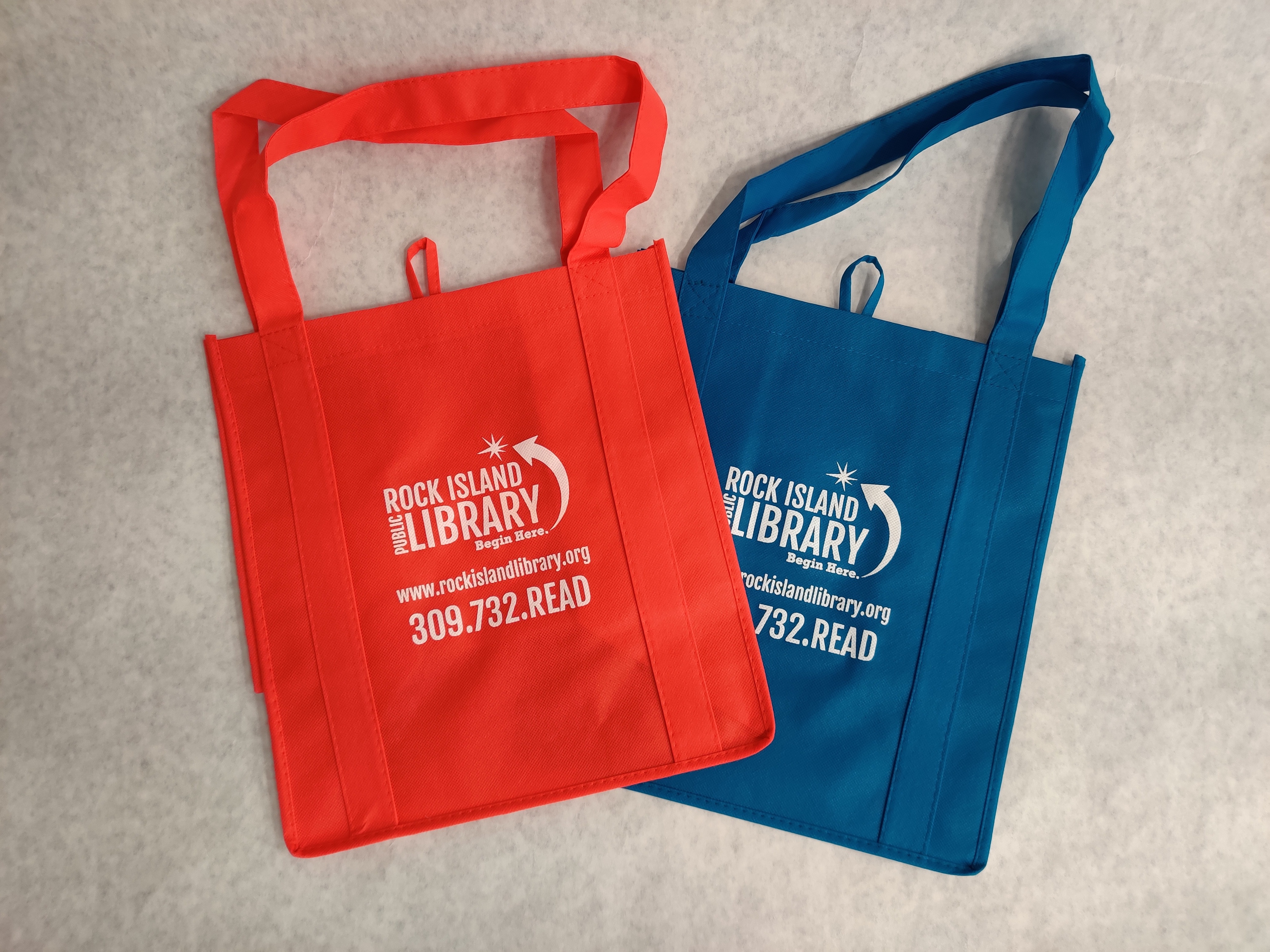 Red and blue library bags