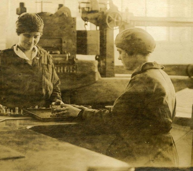 women rolling cartridges circa WW 1 at Rock Island Arsenal Dept of Army image