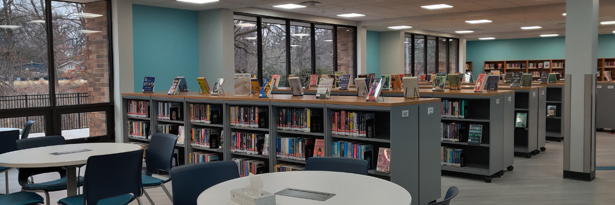 long view of inside of Watts-Midtown Branch tables, shelves, books