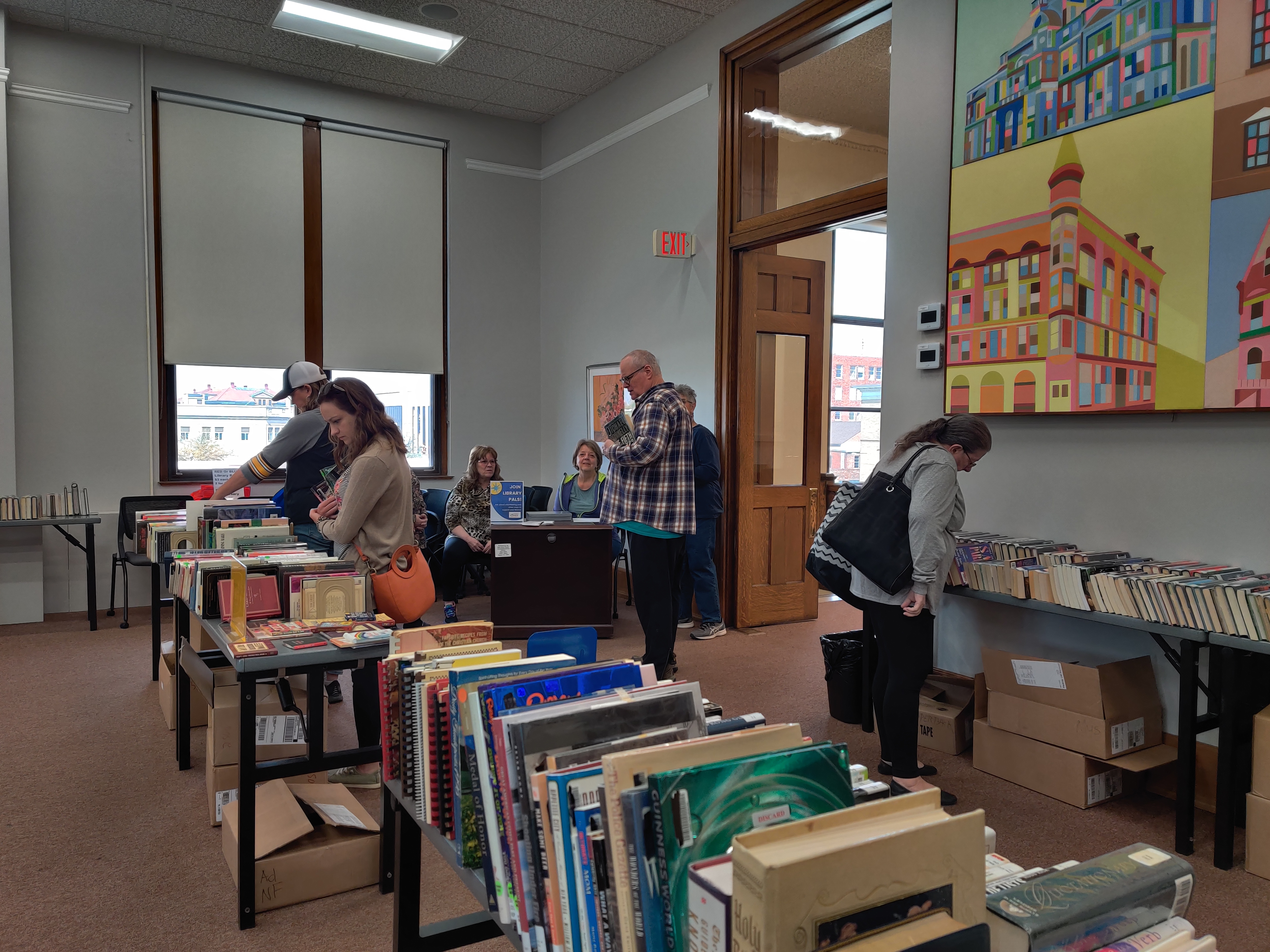 Image of people shopping at Rock Island Library Downtown monthly book sale 