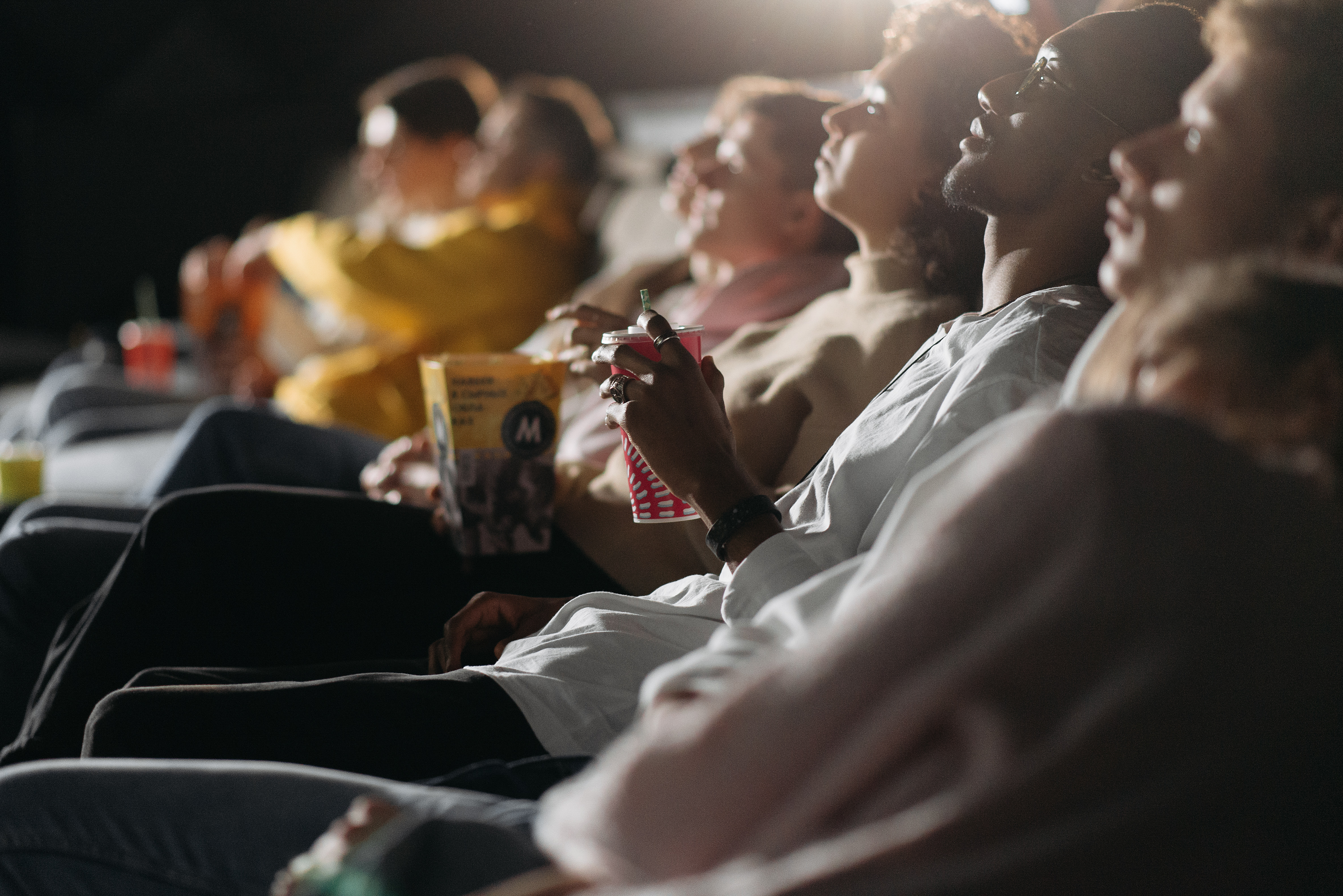 A photo of people watching a movie in a theater.
