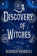Book cover with white text reading "A Discovery of Witches" by Deborah Harkness, featuring a celestial theme against a dark blue background