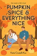 Book cover with black text reading "Pumpkin Spice & Everything Nice" by Katie Cicatelli-Kuc, featuring a man and woman sitting at a bench surrounded by orange trees and pumpkins against a light orange background
