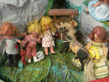 Closeup of dolls in the Story Mountain exhibit