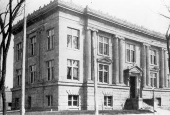 Black and white photo of original Main Library building with roof detail