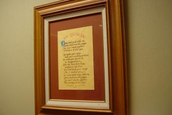 Framed handwritten text of "The Reading Song"