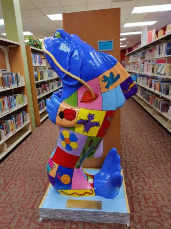 Side view of colorful, blocky catfish statue