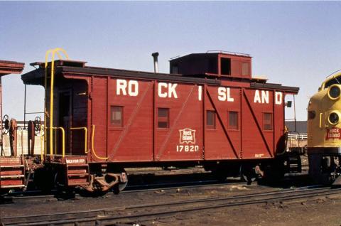 A single red Rock Island railroad caboose