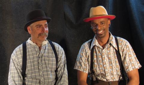 Image of performers Cherry and Jerry wearing hats.