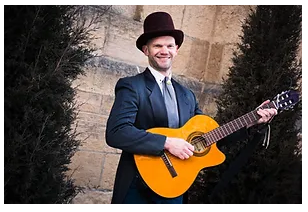 Duke Otherwise holding a guitar