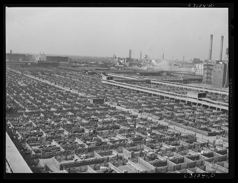 A black and white aerial photograph of the historic Chicago stockyards