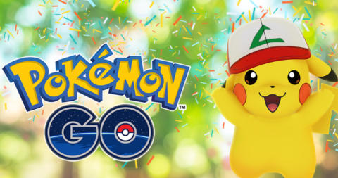 The Pokemon Go Logo (rendered in blue and yellow letters) appears surrounded by confetti, a mostly green background implying the outdoors, and a Pikachu wearing Ash's hat from the TV series jumping in celebration.
