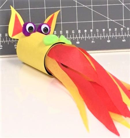 Dragon head made out of paper towel roll, construction and tissue paper flames