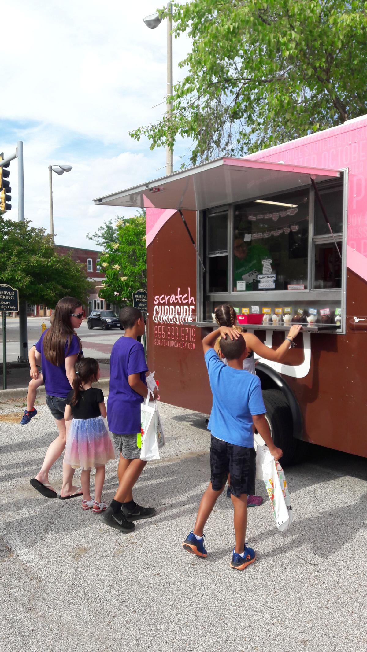 People waiting to buy at the Scratch Curbside Cupcakery May 2018 RI Downtown Librayr
